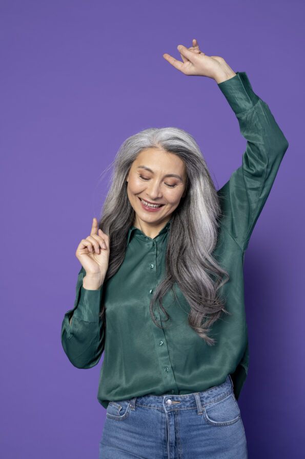 medium shot smiley woman with purple background